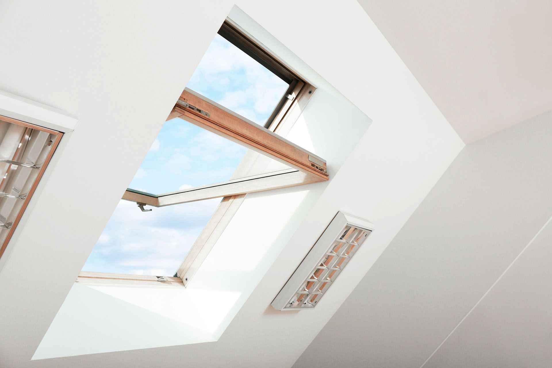 There is a skylight in the ceiling of a room.