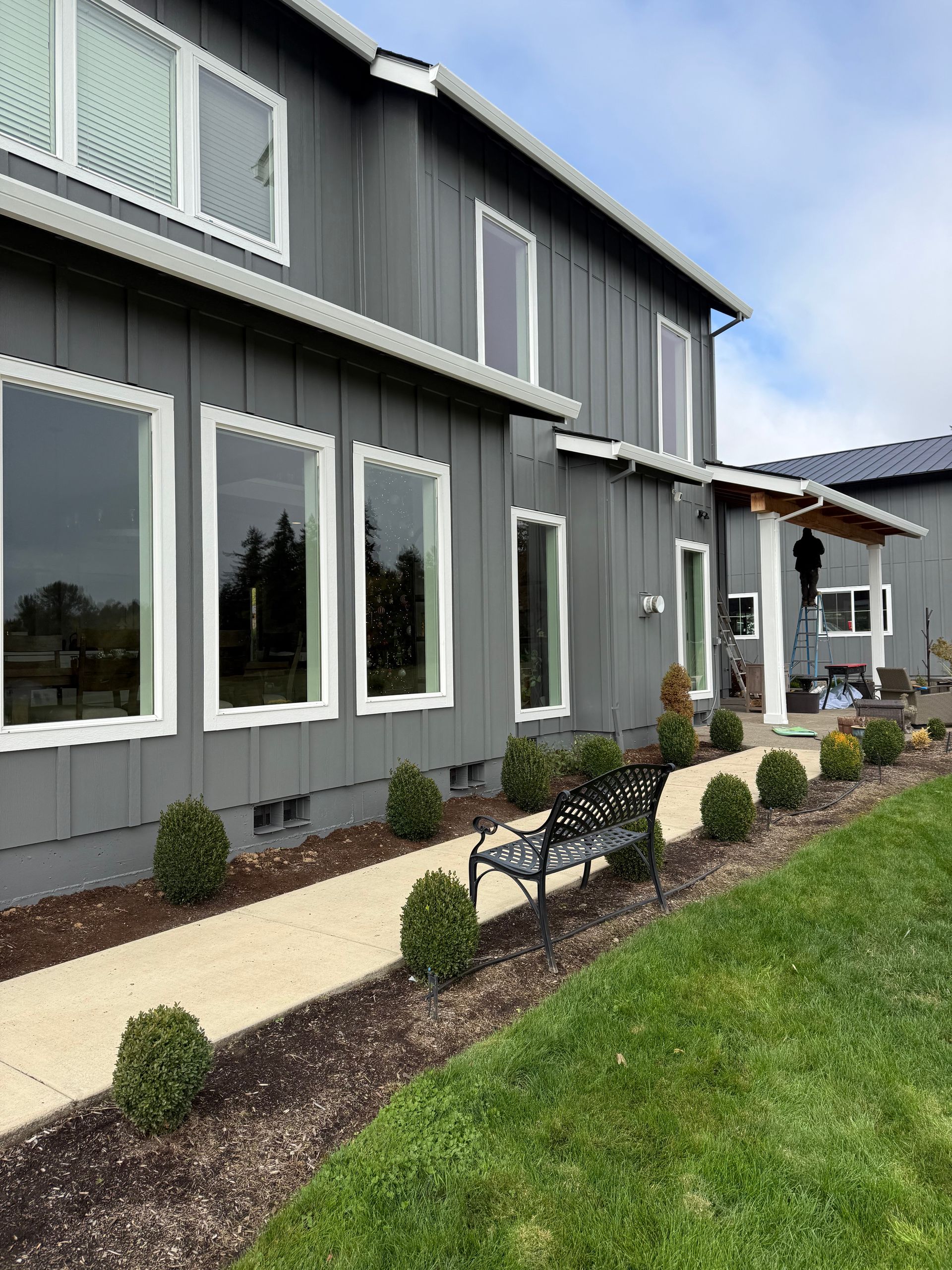 A person is painting a door with a brush.