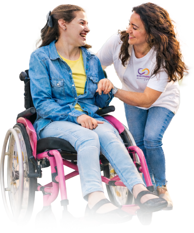 Woman helping a smiling wheelchair user outdoors