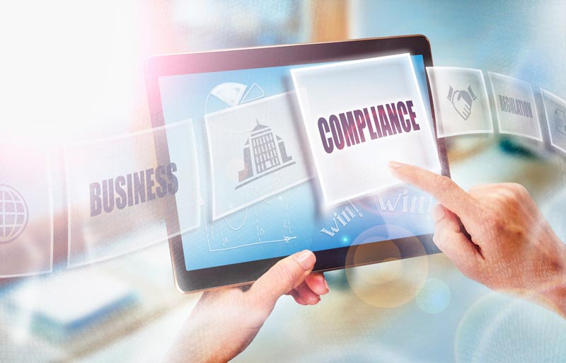 Hands Holding Tablet With Compliance Graphic — Tampa, FL — Aer Consulting Inc