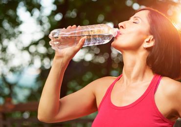 Reverse Osmosis — Athletic Woman Drinks Water in Arroyo Grande, CA