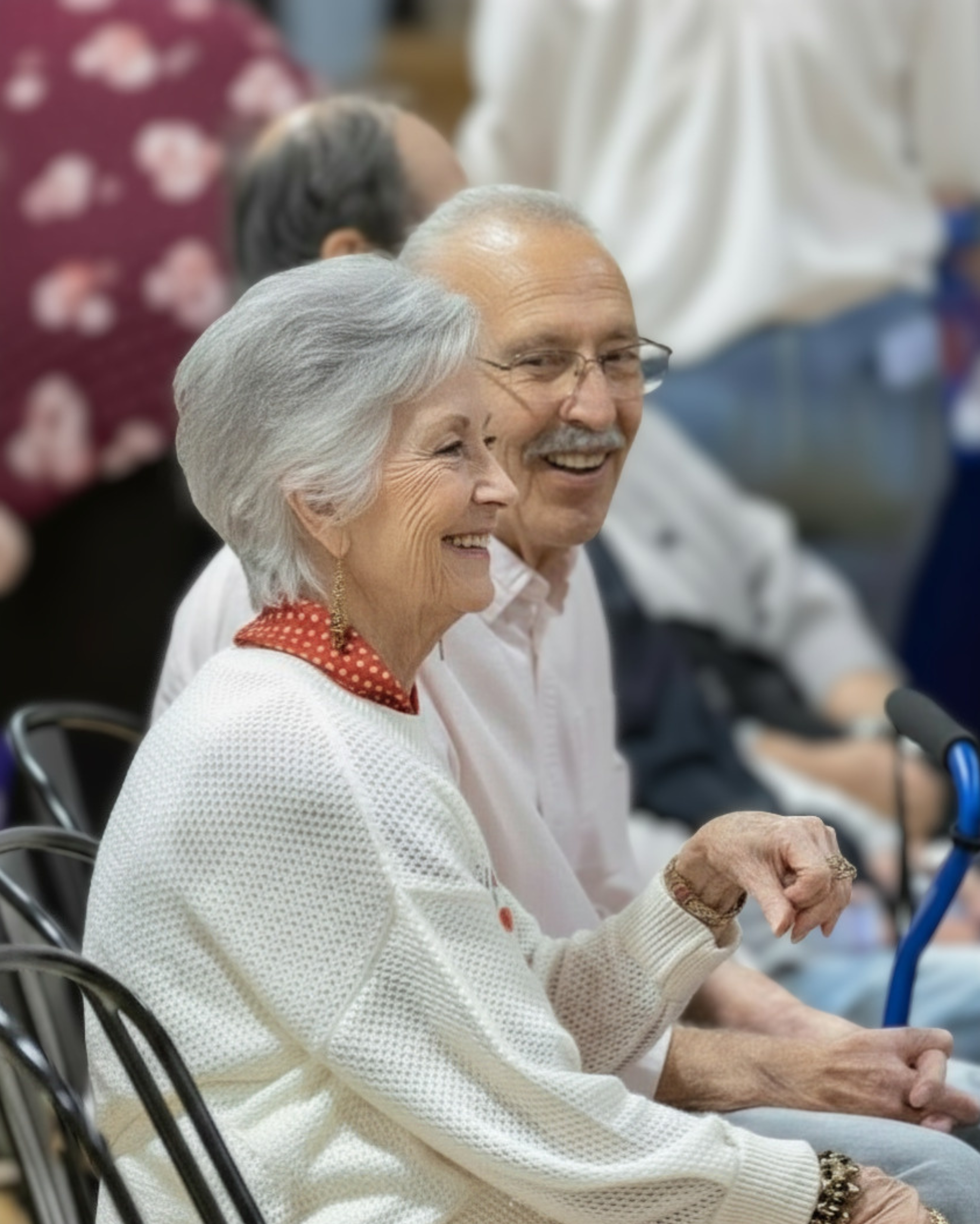 A couple smiling together, learning about Parkinson's disease education