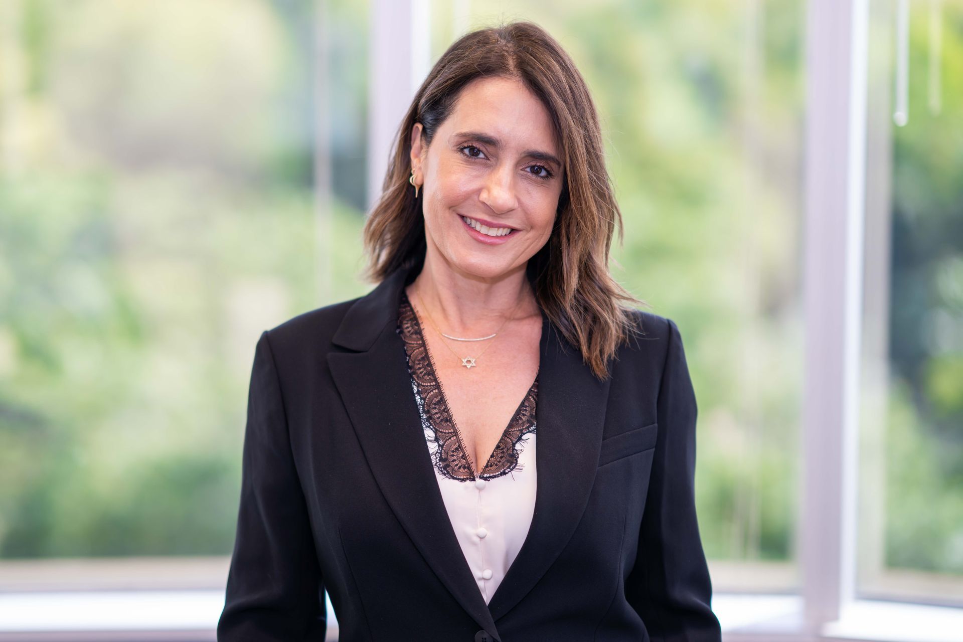 A silhouette of a man without a face on a gray background.