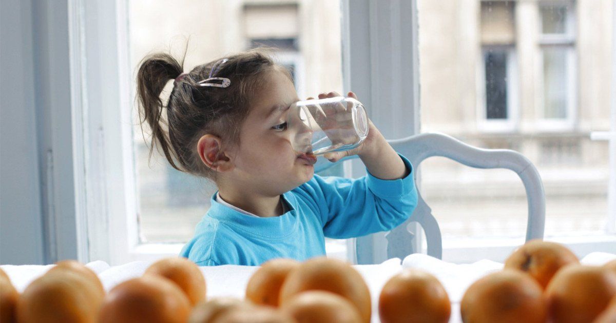 girl drinking un-chlorinated, filtered water