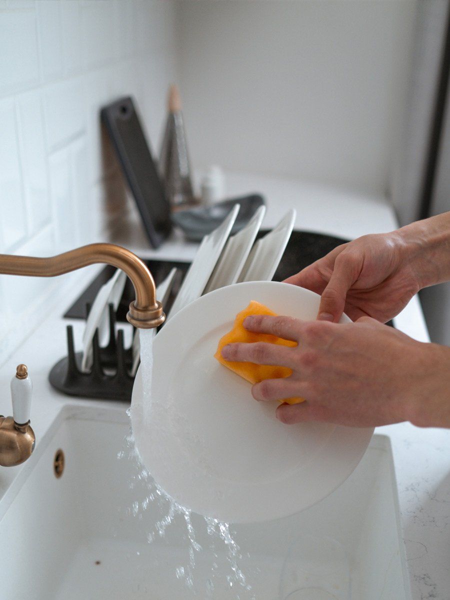 washing dishes in a sink