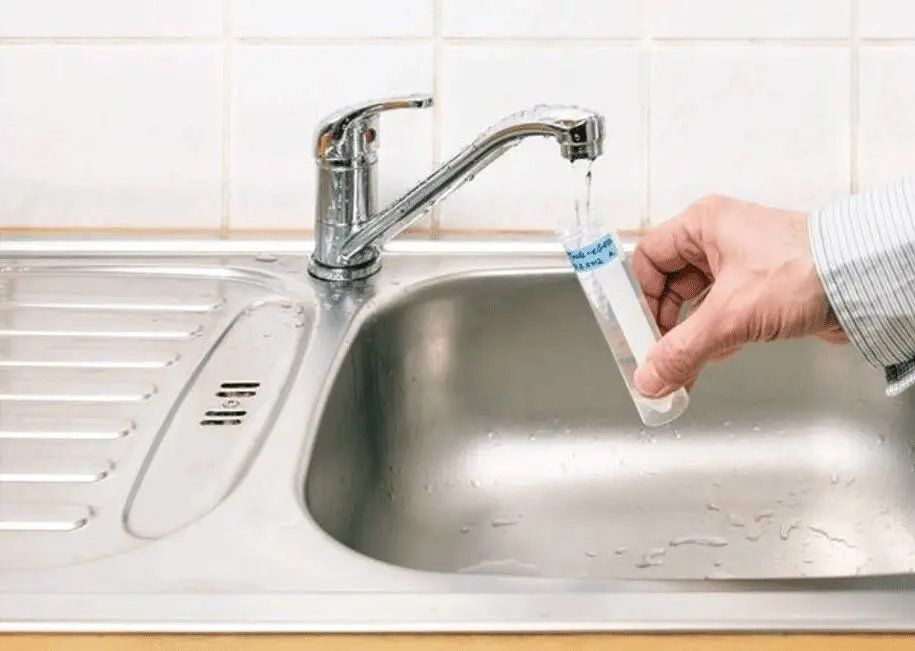 collecting water samples in a sink
