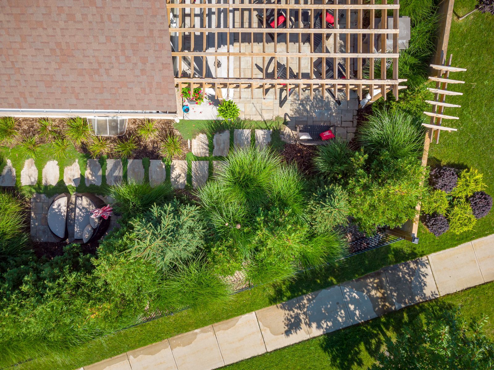 An aerial view of a house with a car parked in front of it.