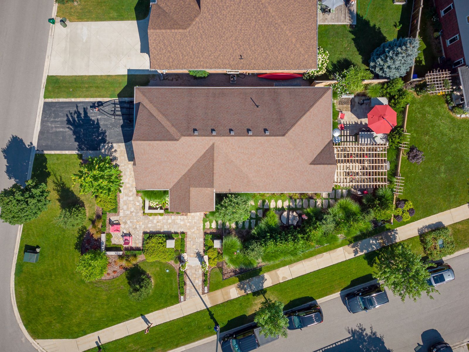 An aerial view of a house in a residential neighborhood.