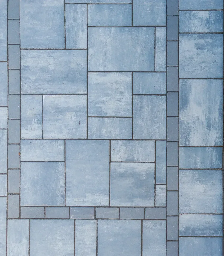 A close up of a blue and white tile floor.
