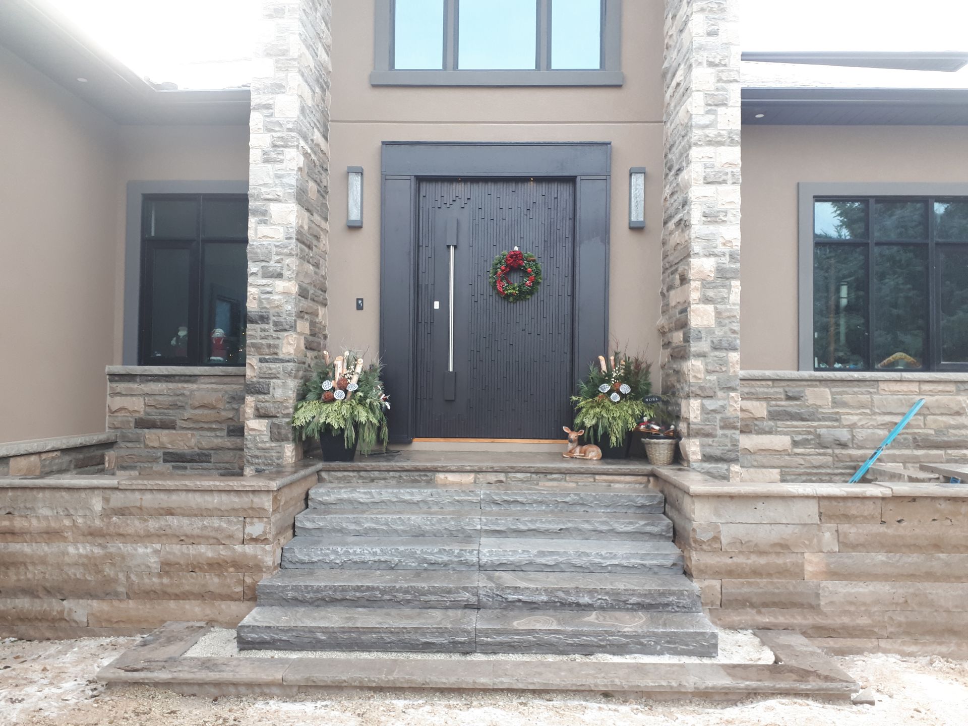 The front door of a house with a wreath on it.