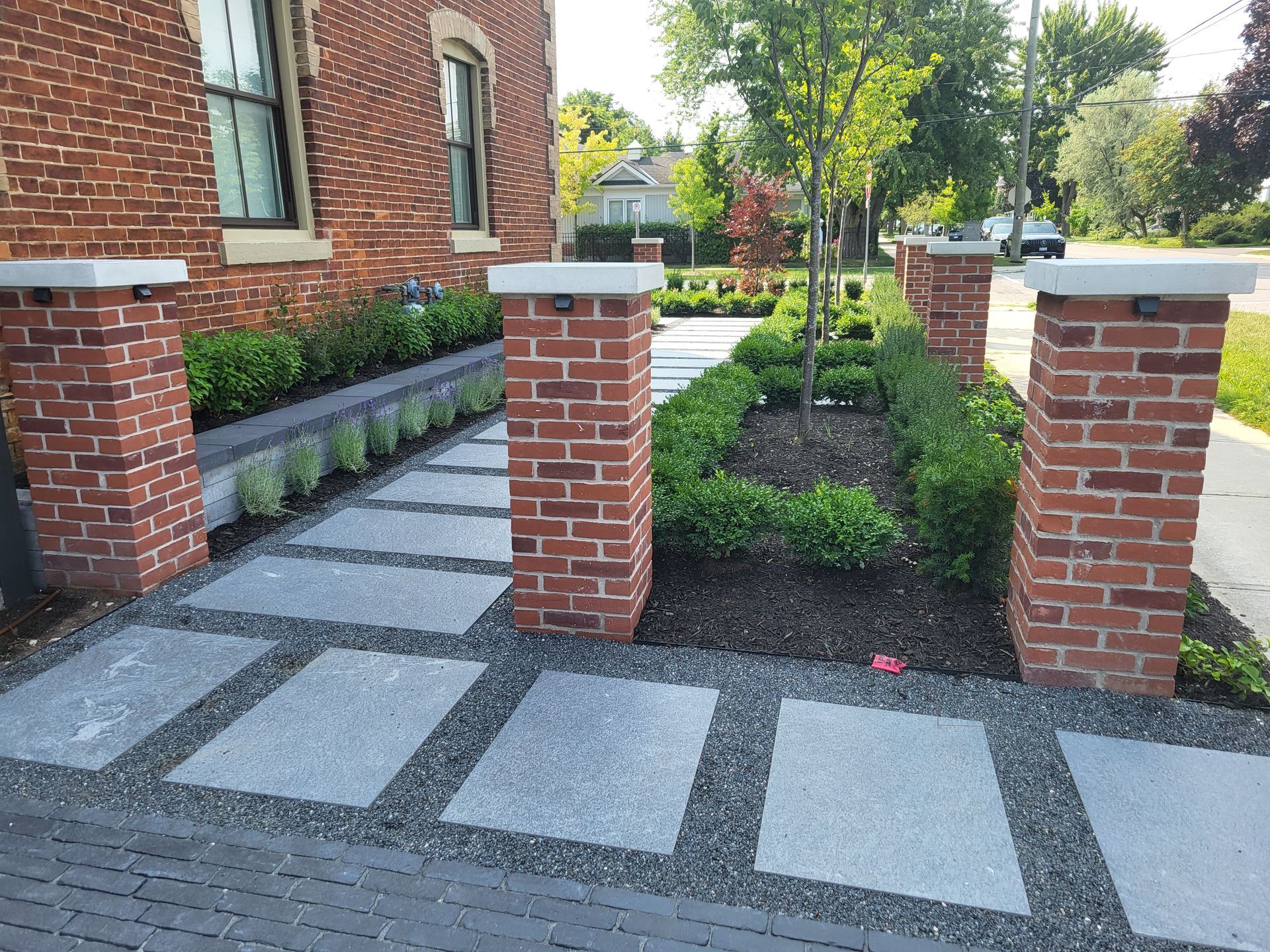 A brick building with a walkway leading to it