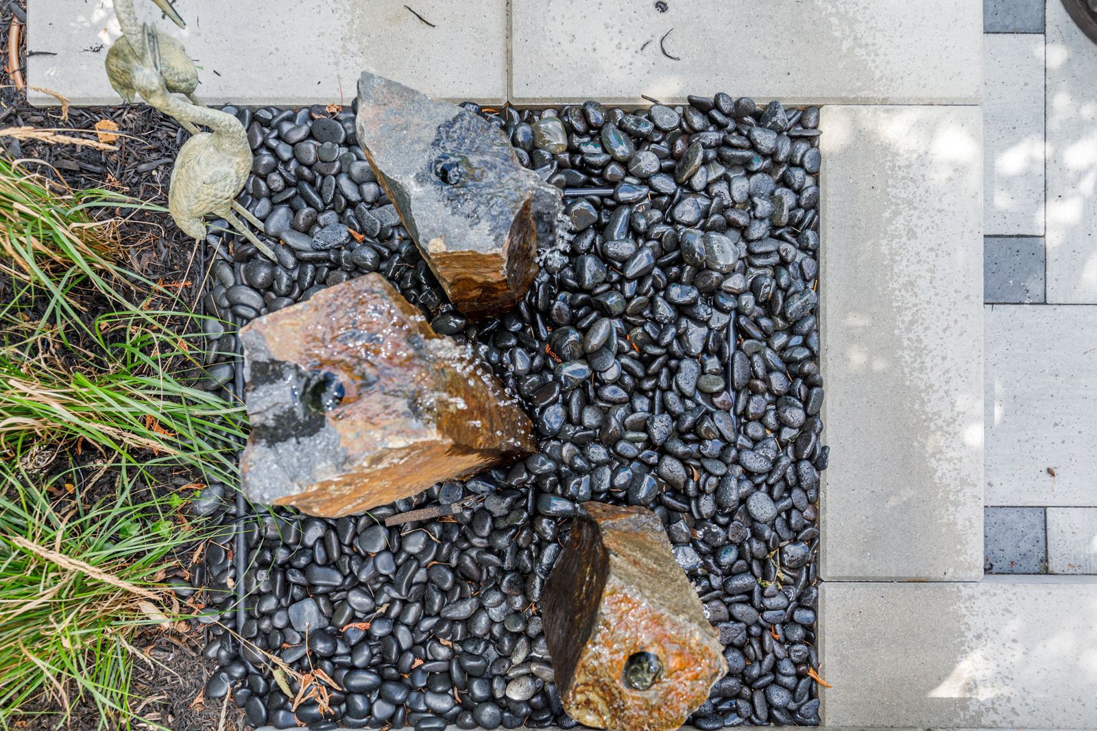 A group of rocks sitting on top of a pile of gravel.