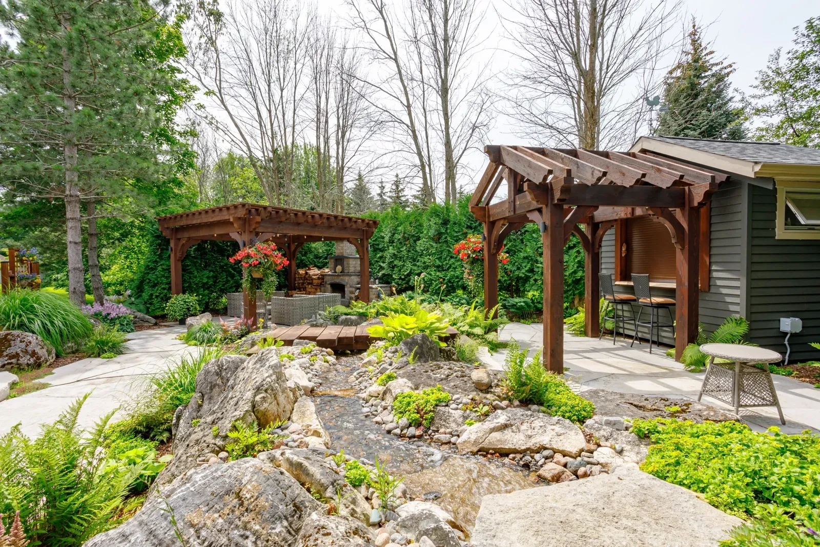 There is a pergola in the middle of the garden.
