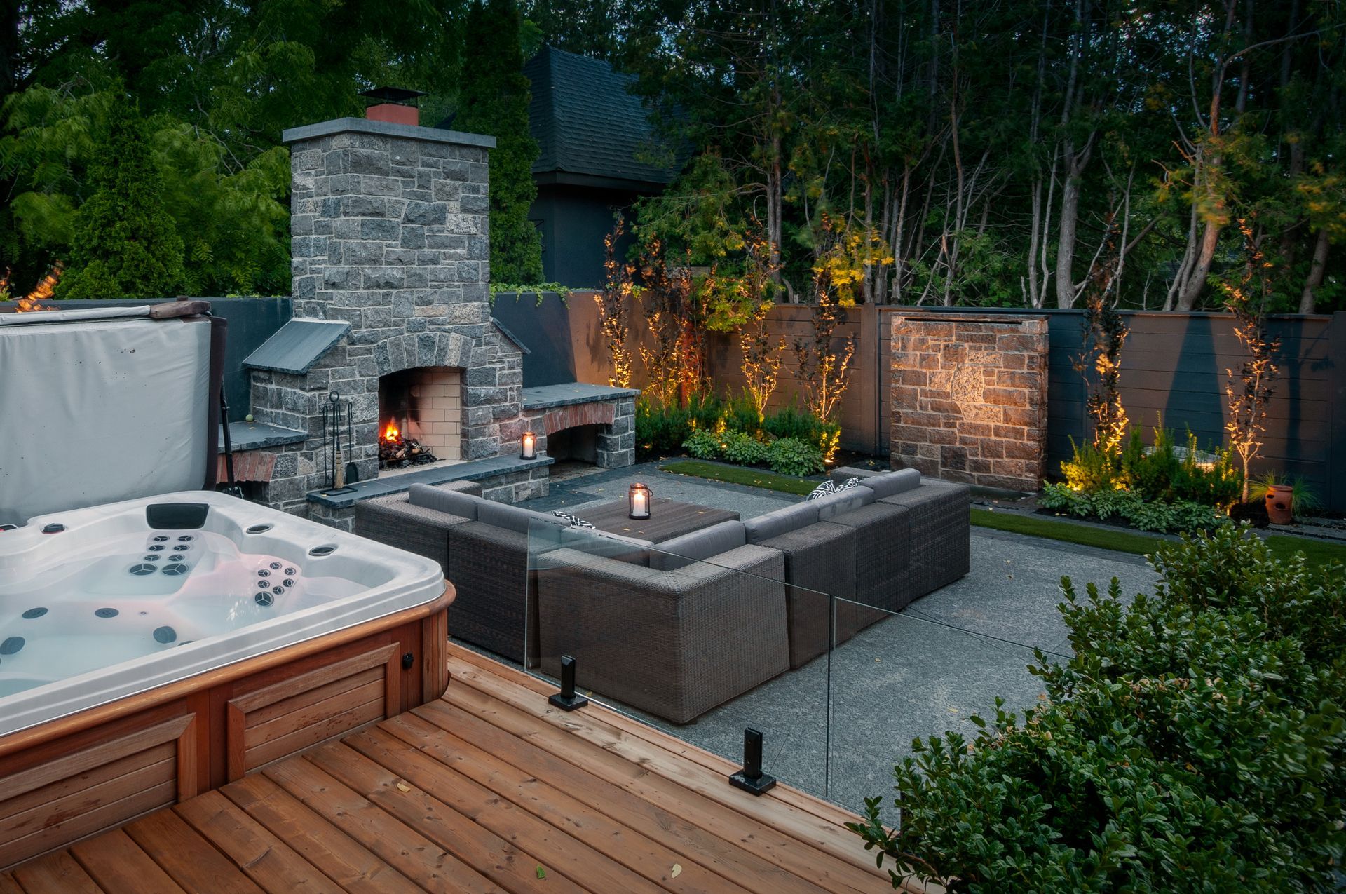 There is a hot tub and a fireplace in the backyard.