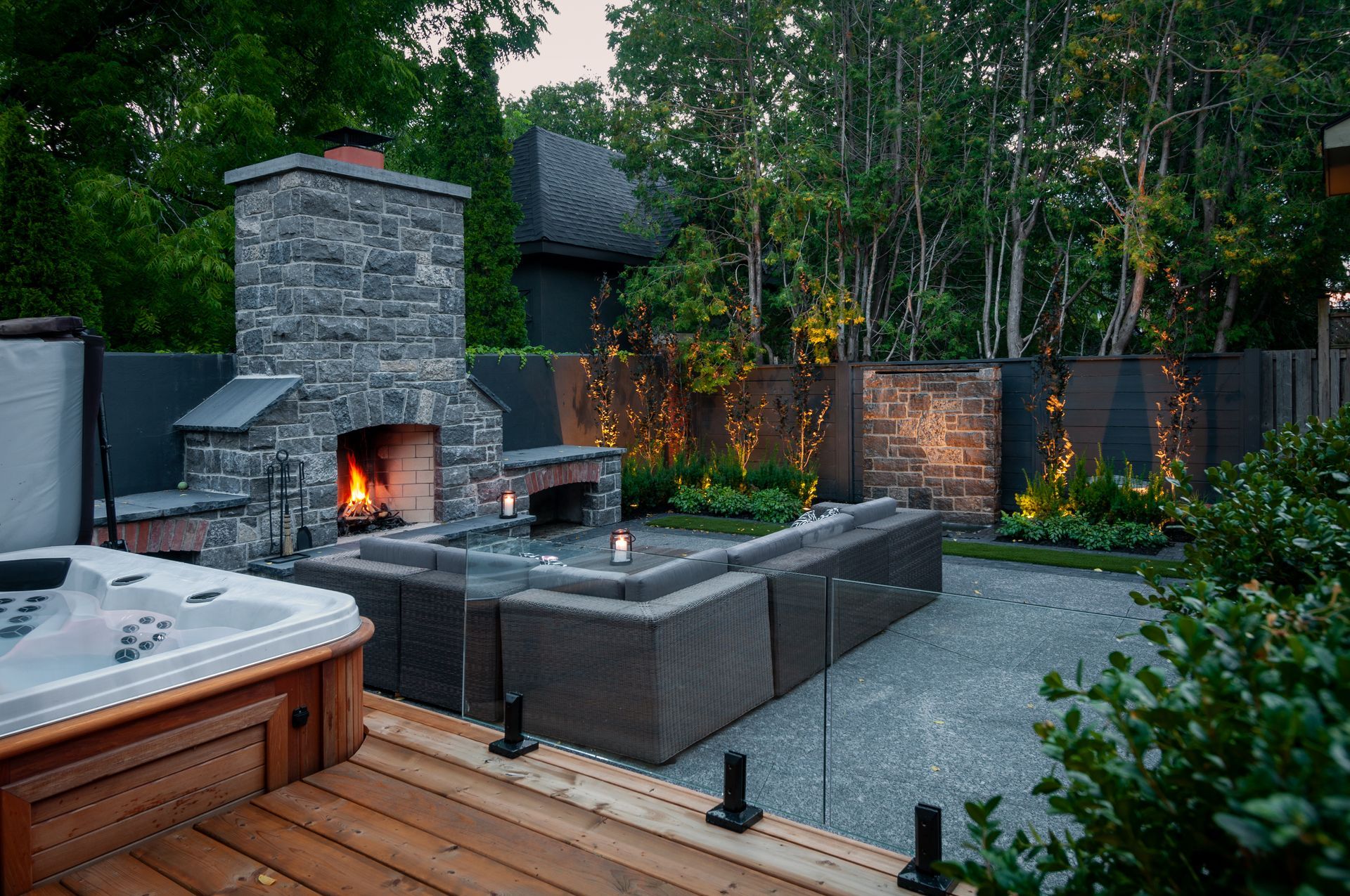 There is a hot tub and a fireplace in the backyard.