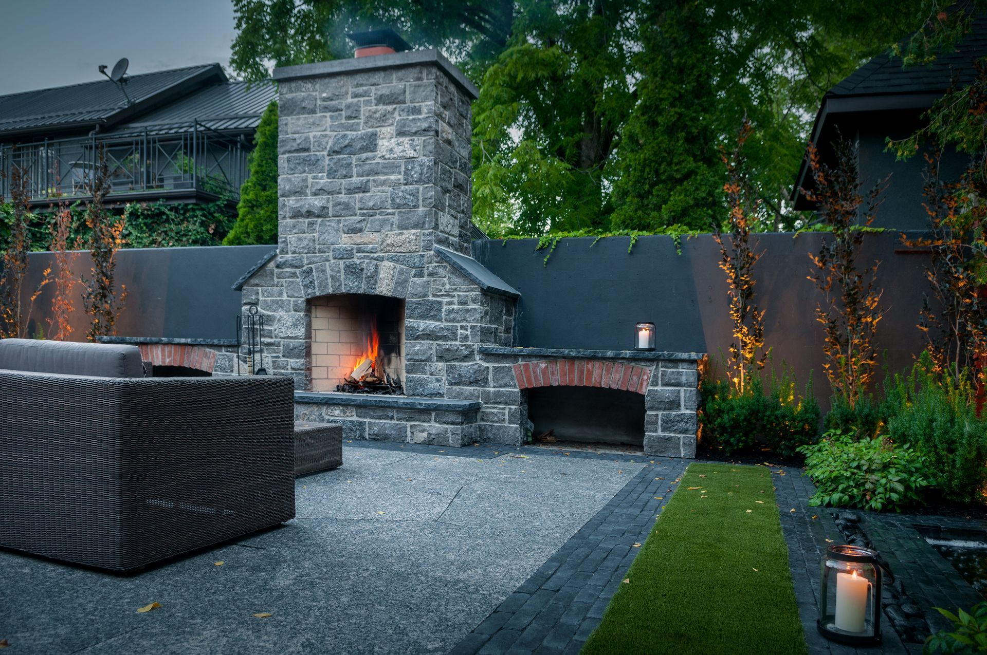 A patio with a fireplace and a couch