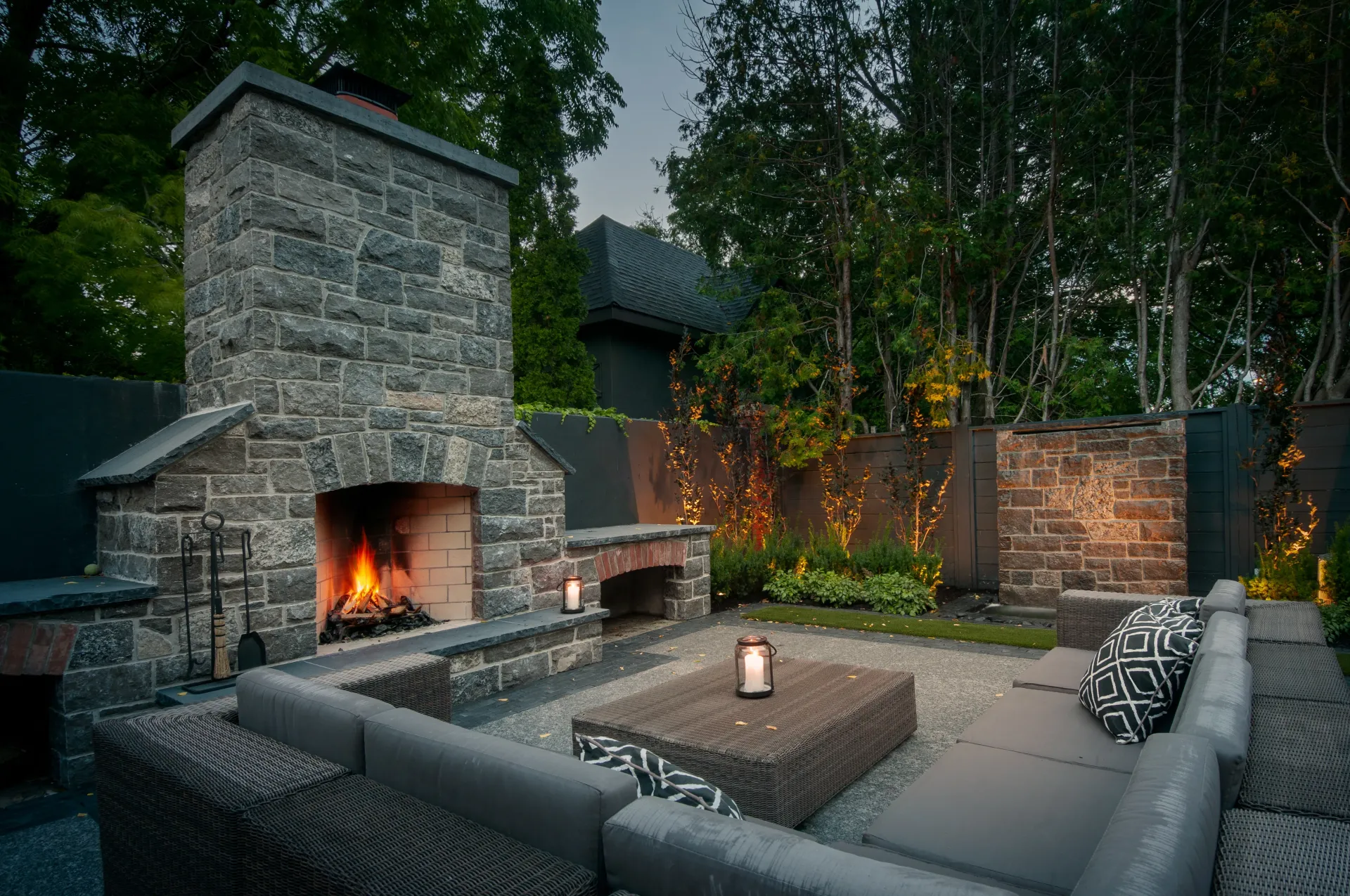 There is a fireplace in the middle of the patio.