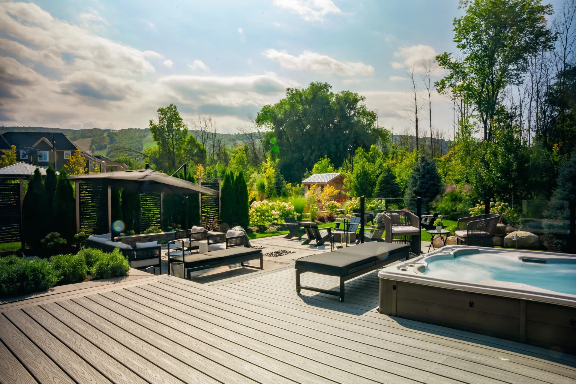 There is a hot tub in the middle of the backyard.