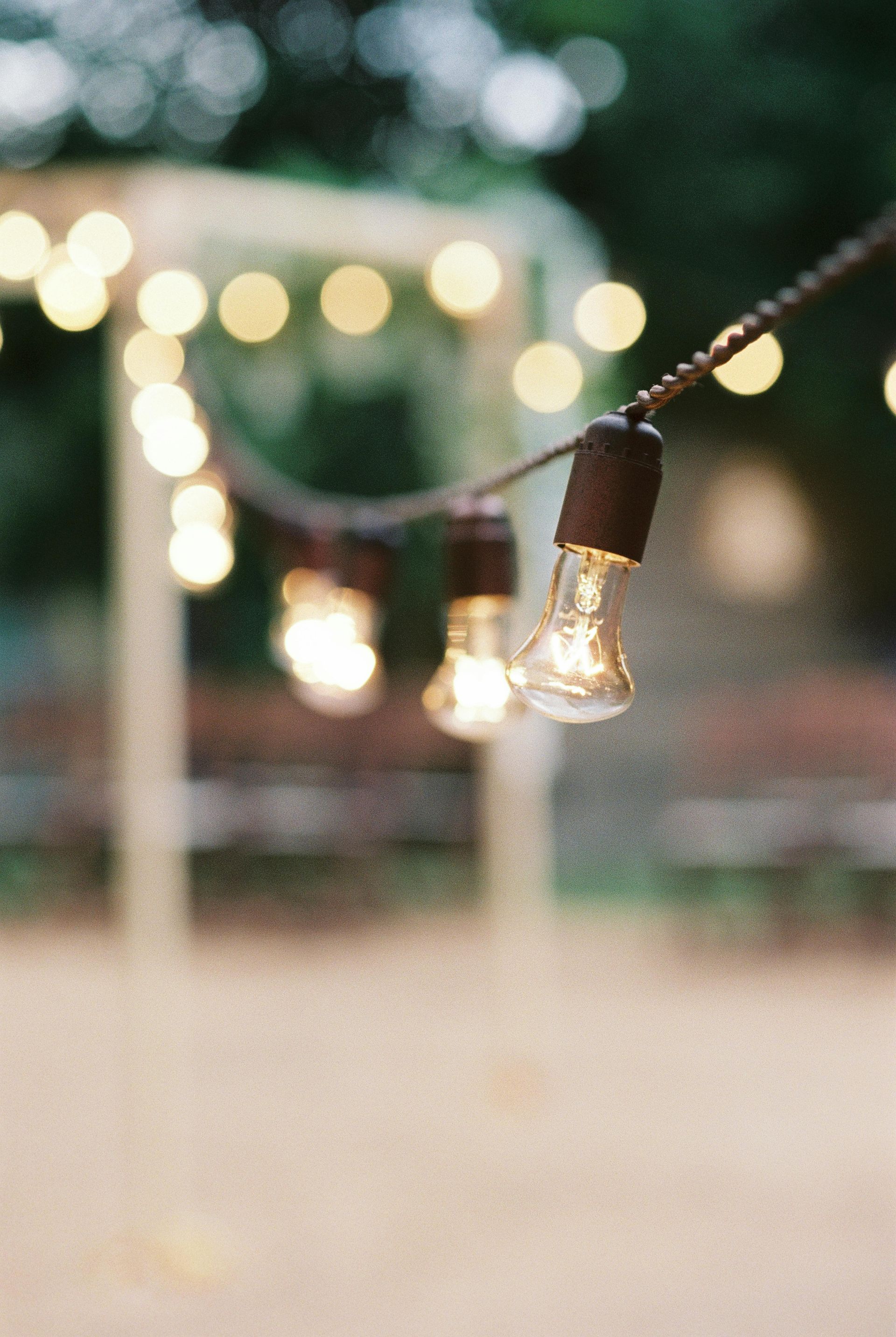 A string of light bulbs hanging from a rope.