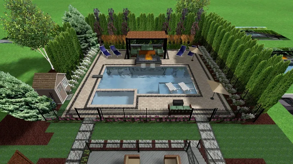 An aerial view of a backyard with a large swimming pool surrounded by trees.