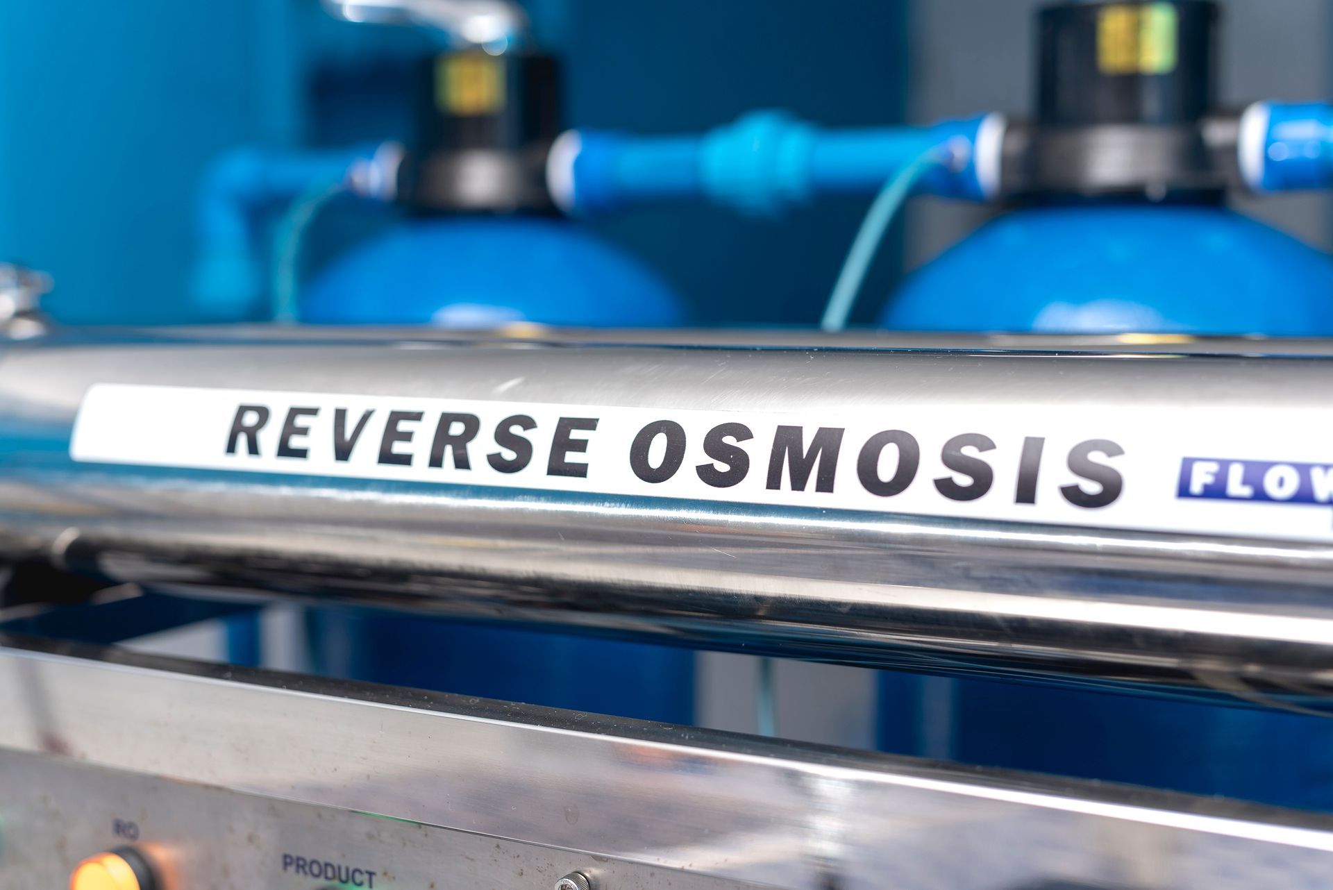 Reverse osmosis water filter system with blue tubing and silver labeled pipe