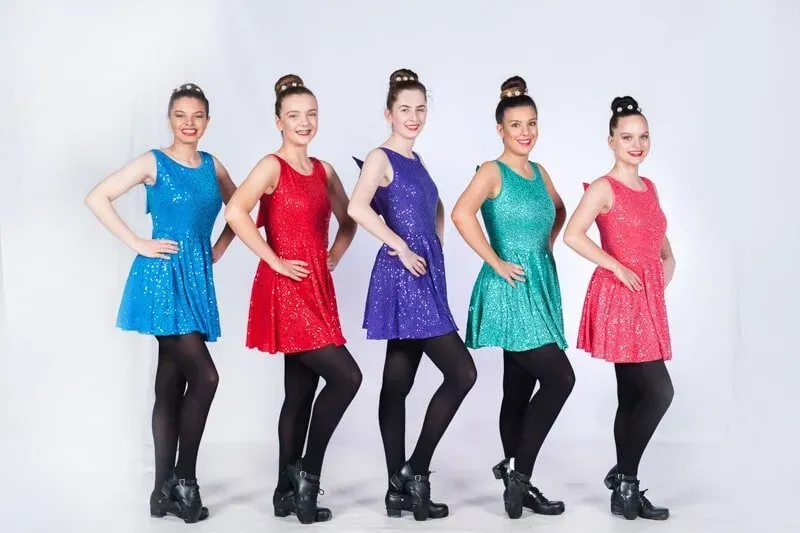 A Group Of Women In Sequined Dresses Are Standing Next To Each Other — International Dance Affair In North Mackay, QLD