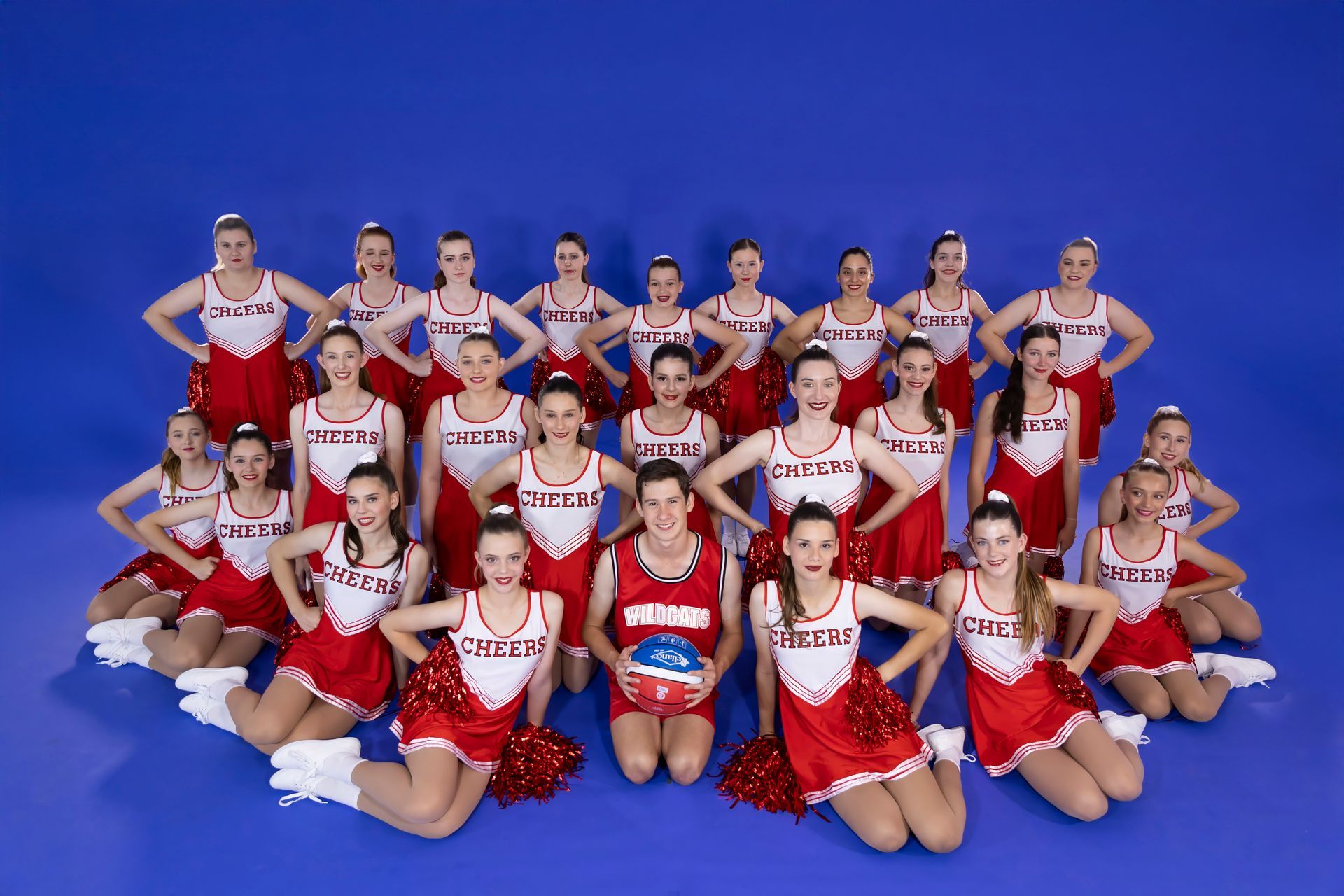A Group Of Young Girls Are Sitting On The Floor In A Dance Studio — International Dance Affair In North Mackay, QLD
