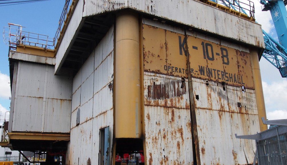 Yellow and white industrial structure, labeled 