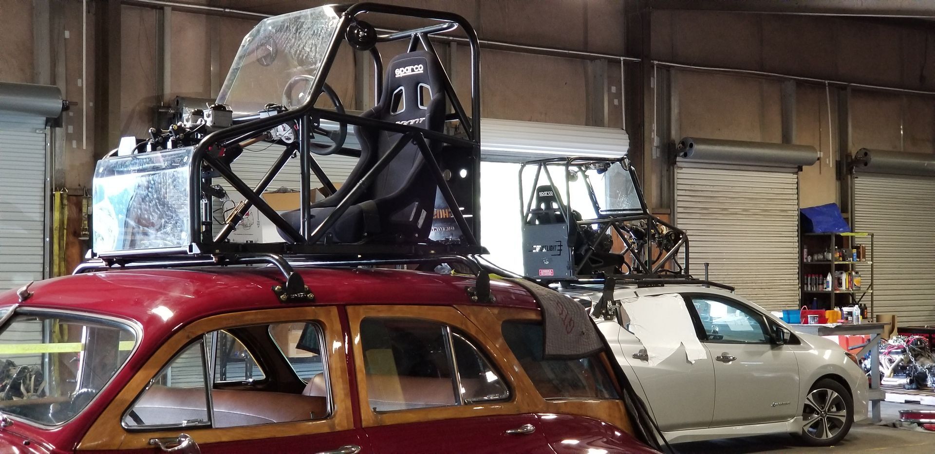 a red car with a roof rack on top of it