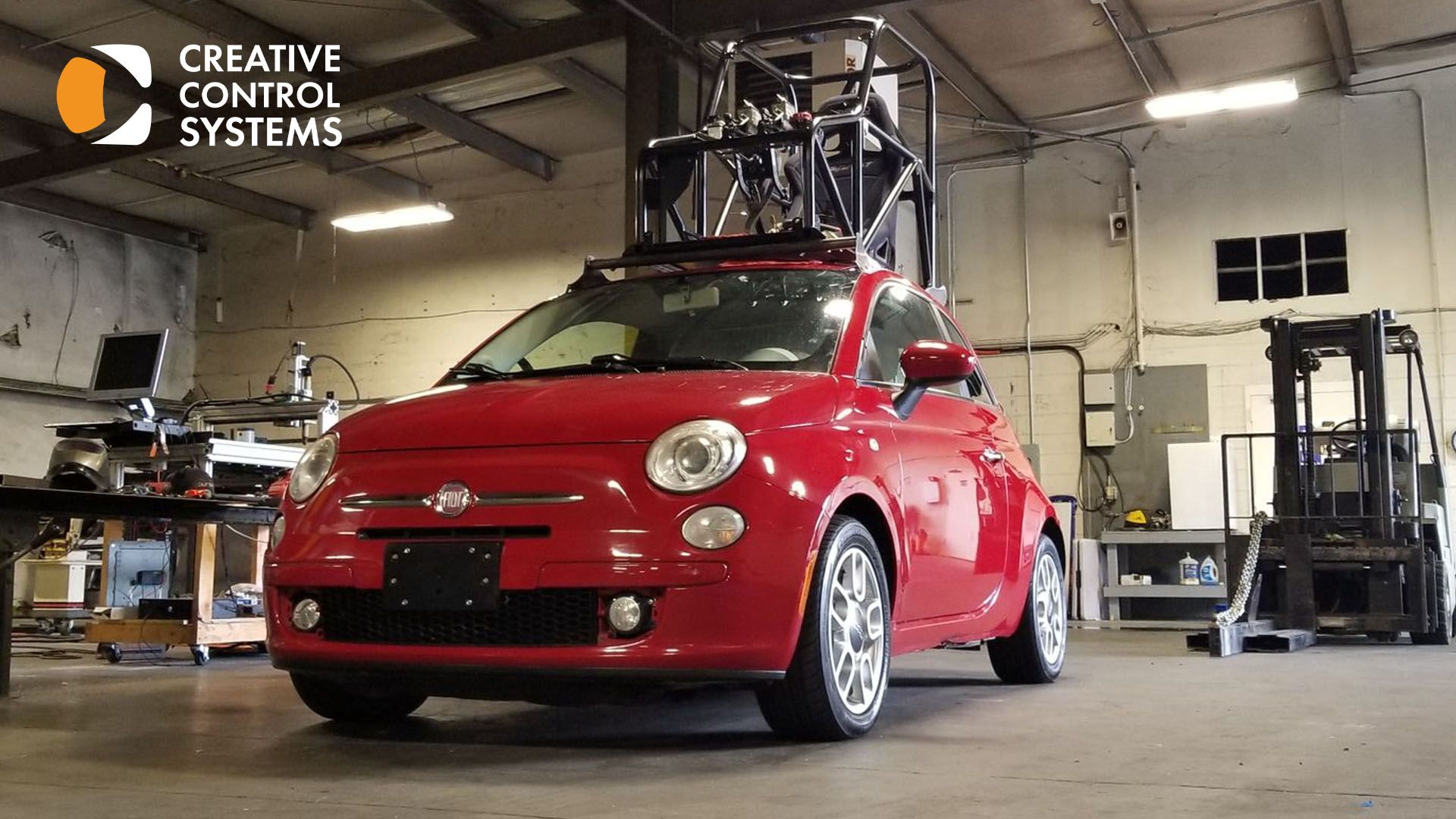 A red car equipped with a crane on its roof, showcasing innovative filming techniques for dynamic storytelling.