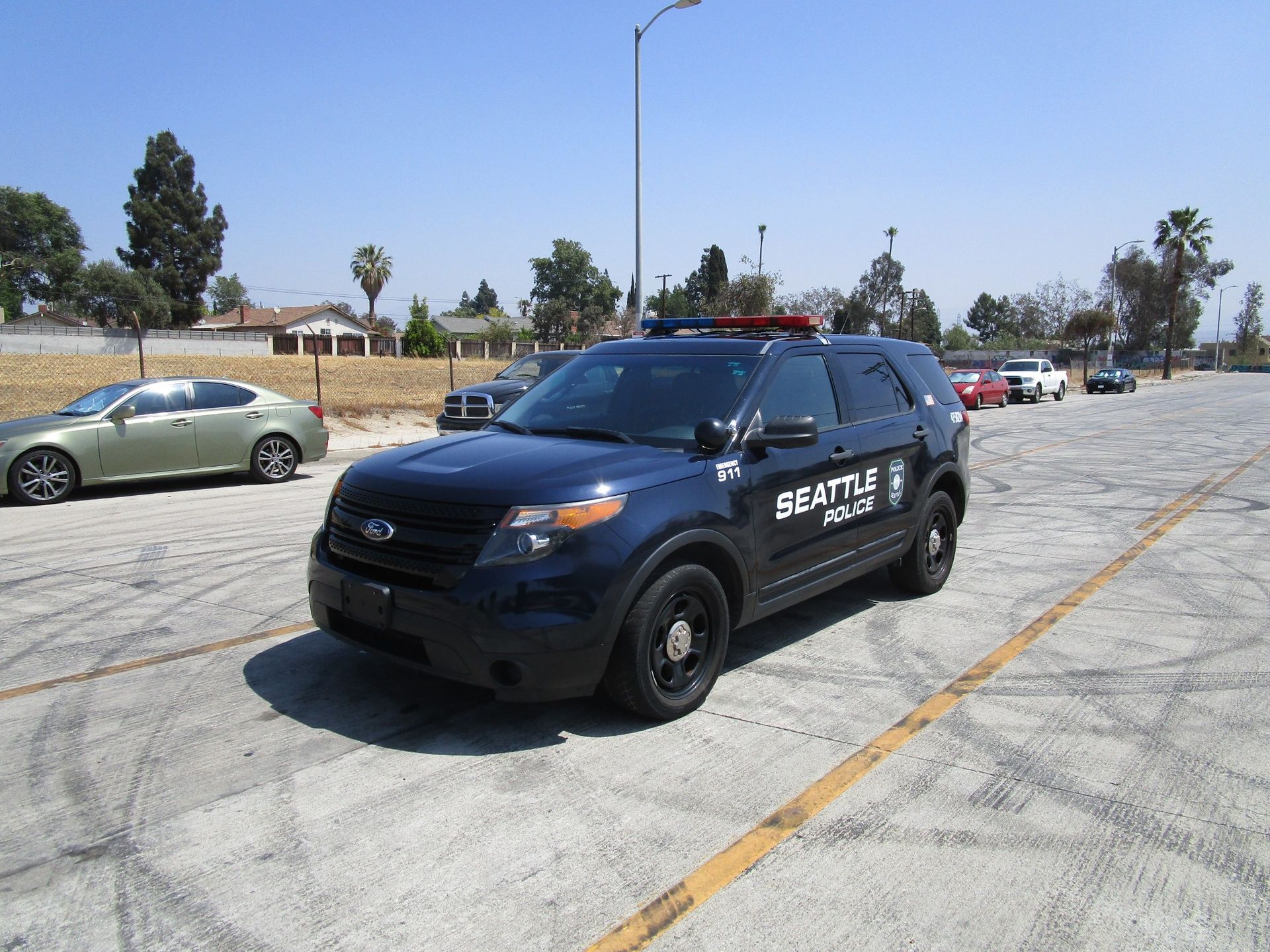 A black car is parked and ready to install pod rigs for film shooting.
