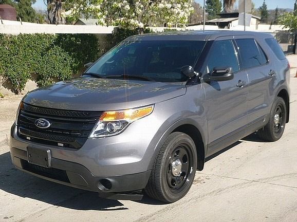 a ford explorer car is parked and ready to install pod rigs for film shooting.