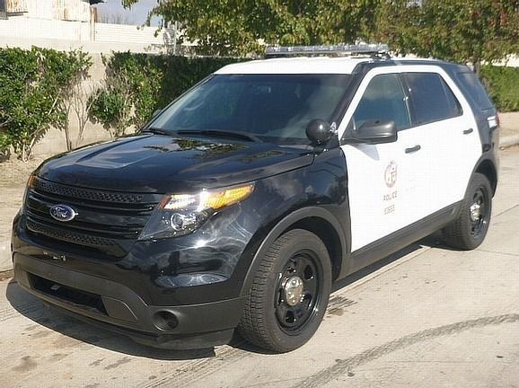 A black and white car is parked and ready to install pod rigs for film shooting.