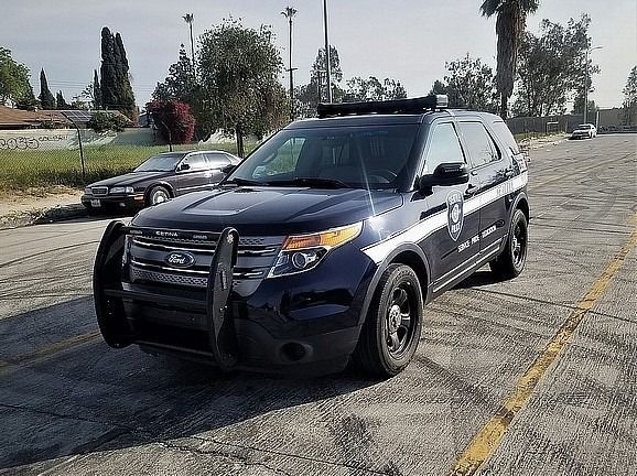 A black car is parked and ready to install pod rigs for film shooting.