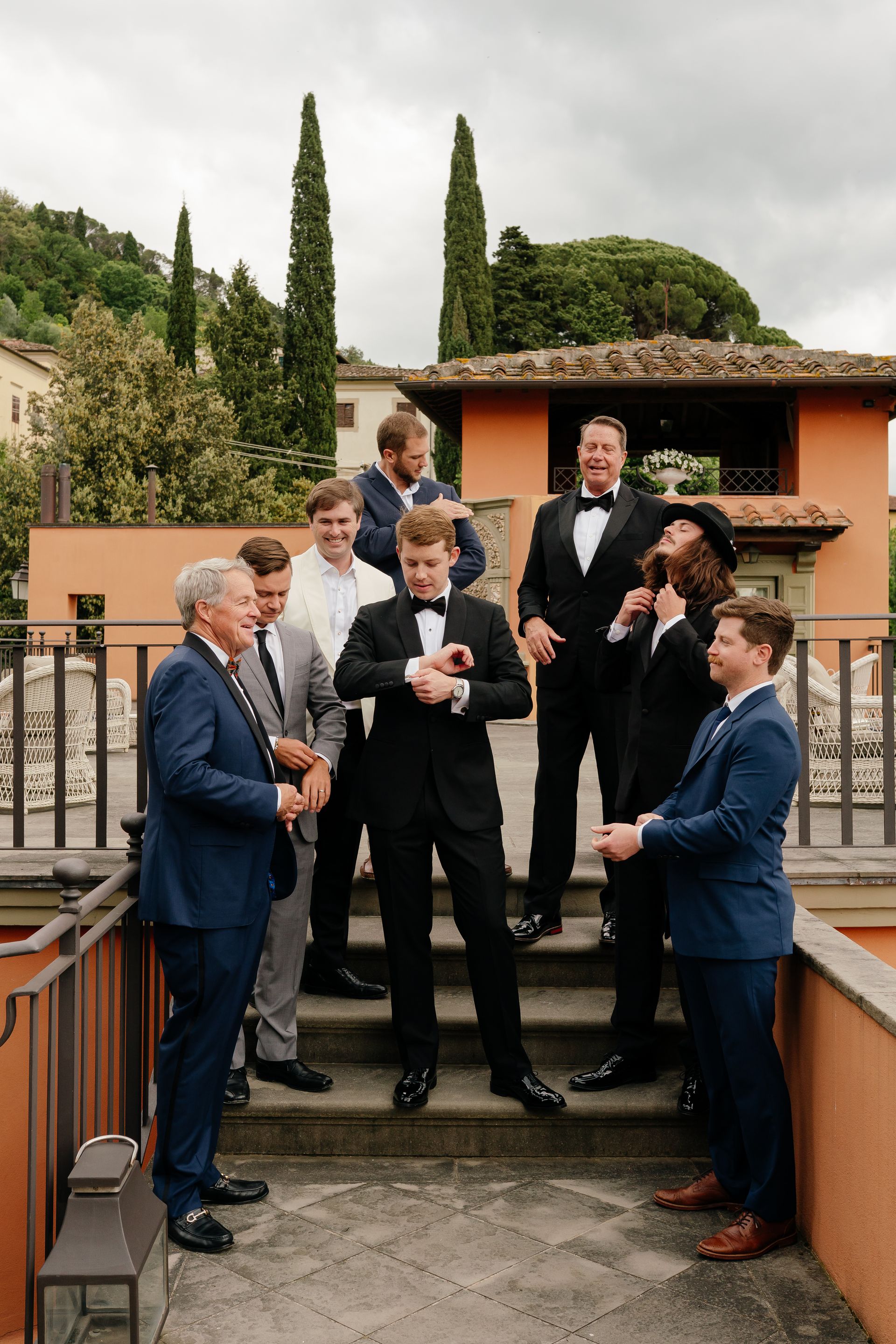 Elegant groomsmen and guests at luxury wedding in Florence Italy, stylish group portrait