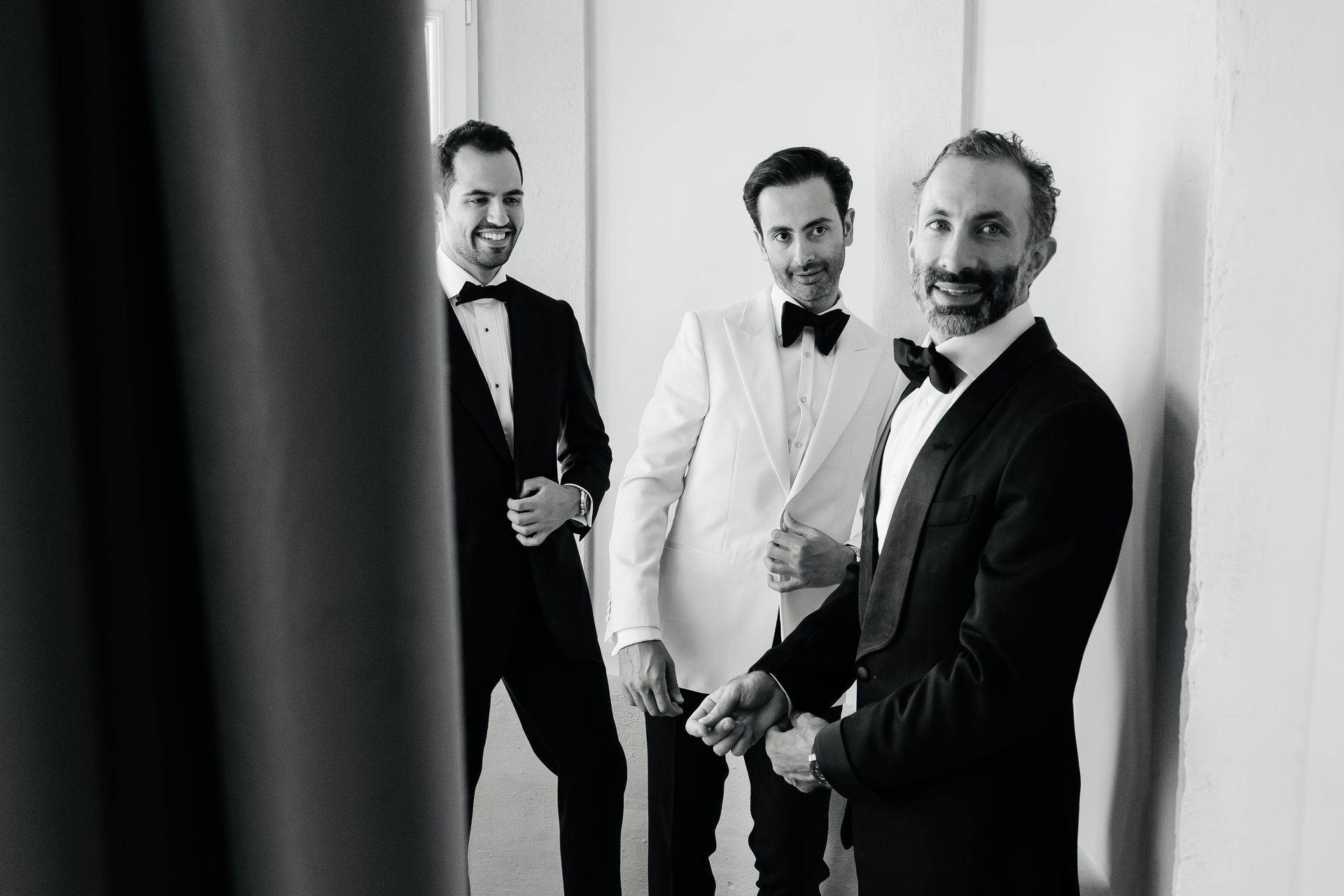 Groom with groomsmen at Villa Arvedi Verona in black and white during luxury wedding preparation