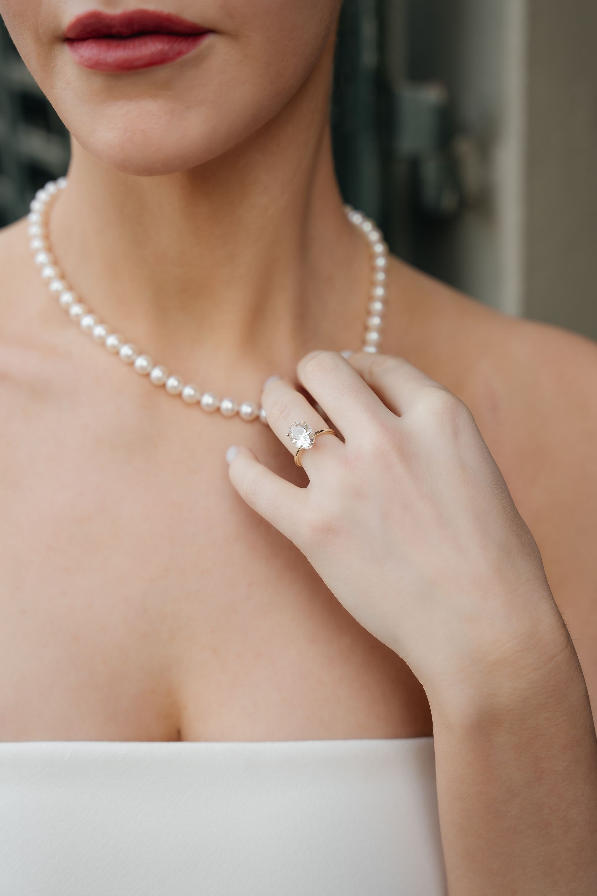 Luxury bridal jewelry details with necklace and engagement ring, elegant wedding preparation