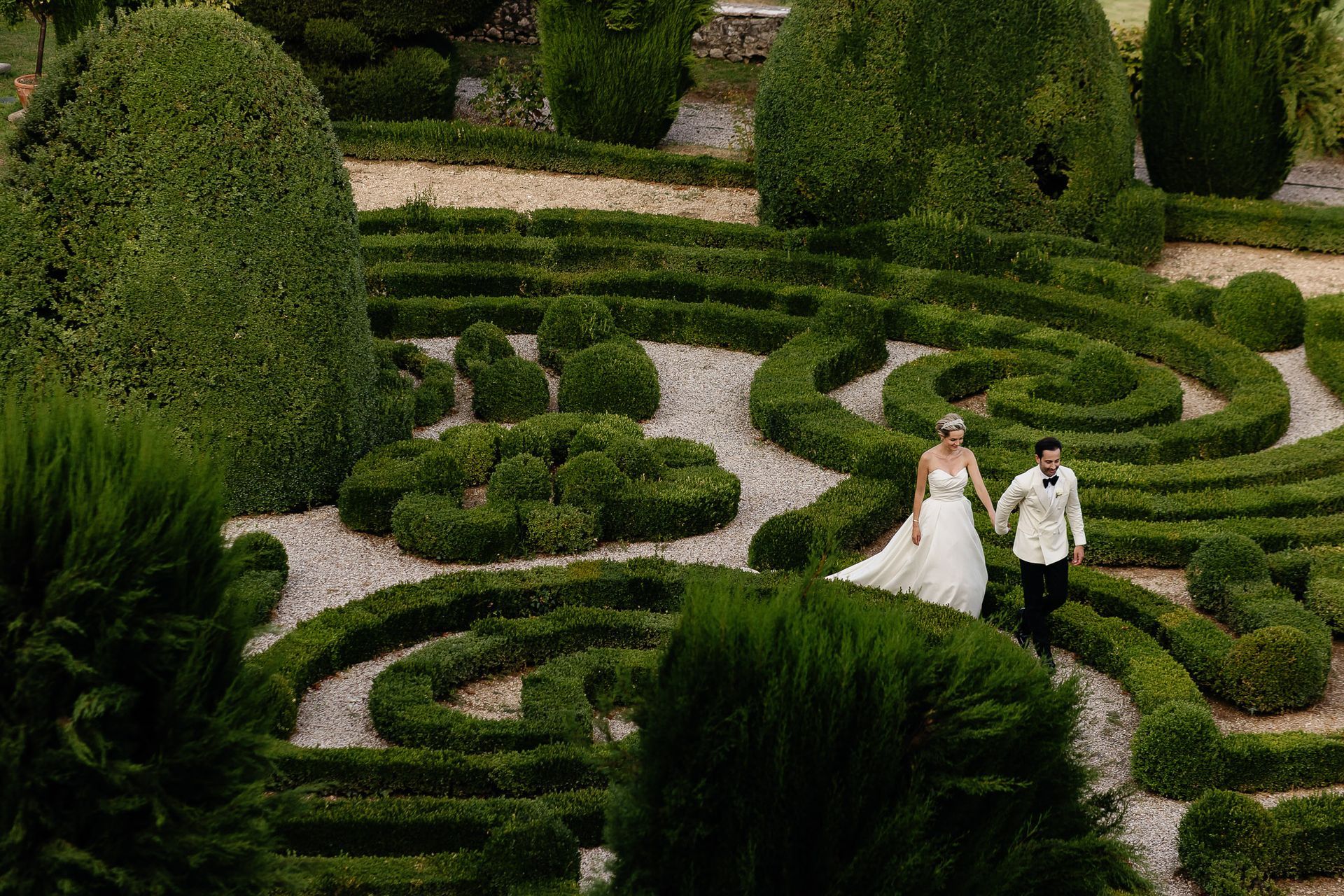 Bride and groom in garden of Villa Arvedi Verona during luxury wedding in Italy