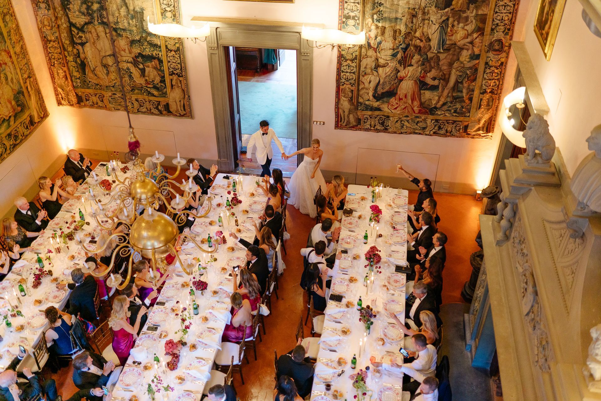 Luxury wedding party in Italy with bride and guests dancing and celebrating together