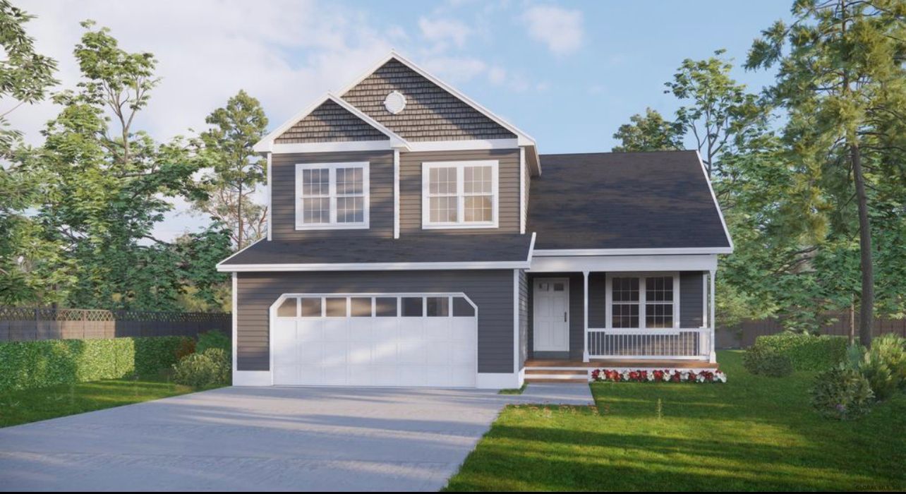 A black and white house with a white garage door