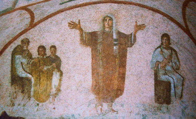 The Cubiculum of the Veiled Woman in Priscilla's Catacombs in Rome. This room is named for the picture in the semi-circle on the back wall, in which a young woman, wearing a rich purple garment and a veil on her head, lifts up her arms in prayer.