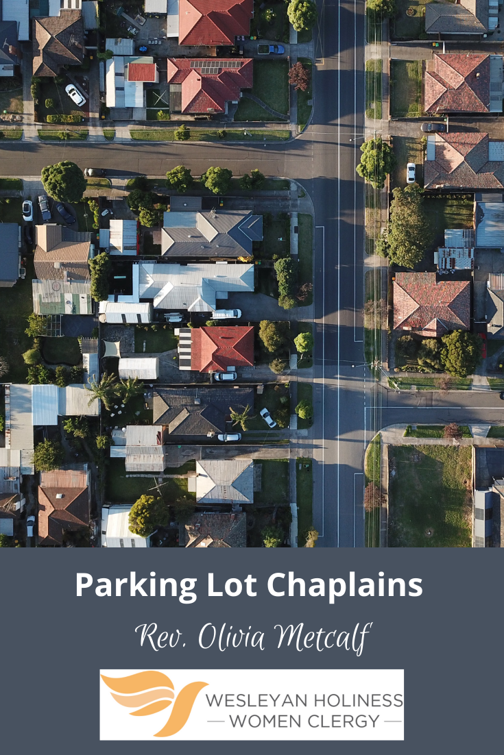 Sky shot of city block. Text at bottom: Parking Lot Chaplains by Rev. Olivia Metcalf. WHWC Logo
