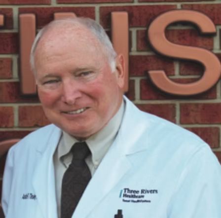 A man in a white coat with the word three rivers on it