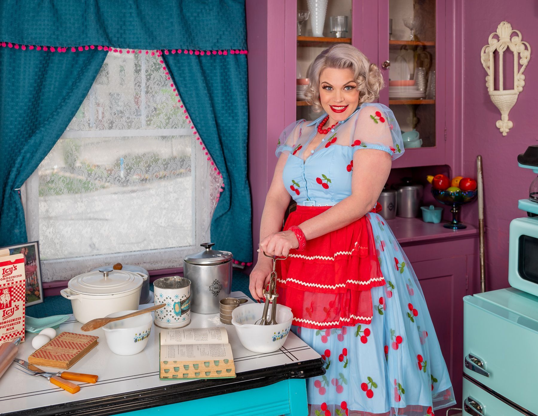 Pin up girl, 1950's inspired, baking/cooking  in vintage studio kitchen