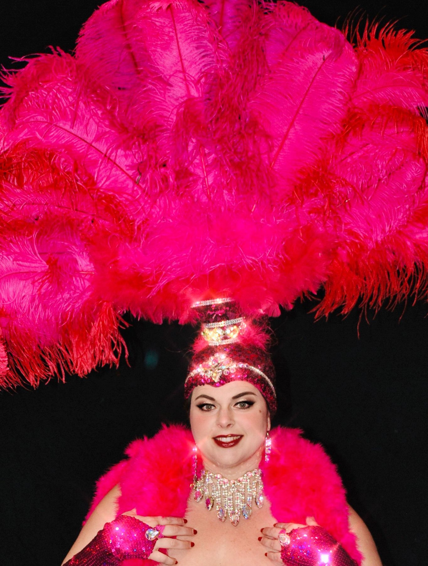 A plus size woman in an authentic Las Vegas showgirls costume.