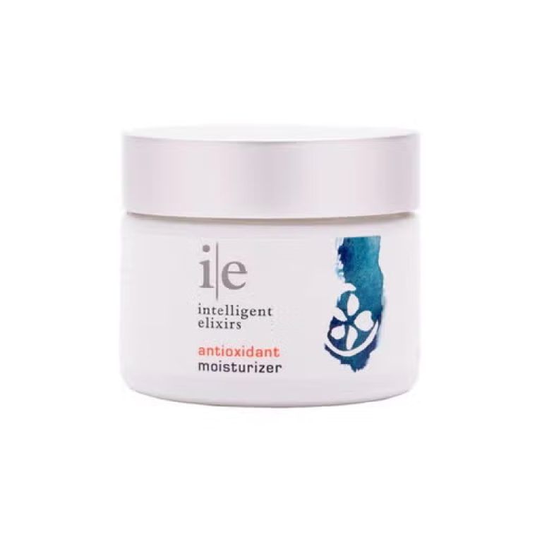 White jar of Intelligent Elixirs antioxidant moisturizer with silver lid, floral design.