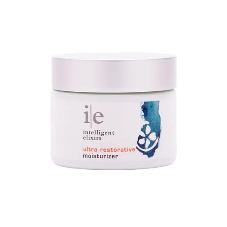 White jar of Intelligent Elixirs Ultra Restorative Moisturizer, with logo and blue floral design.