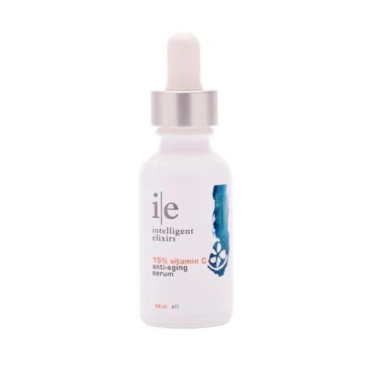 Bottle of ile 15% vitamin C anti-aging serum with a dropper. White bottle with teal floral design and silver cap.