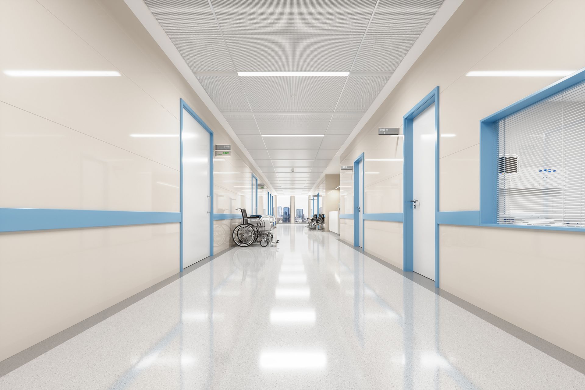 An empty hospital hallway with a wheelchair in the corner.