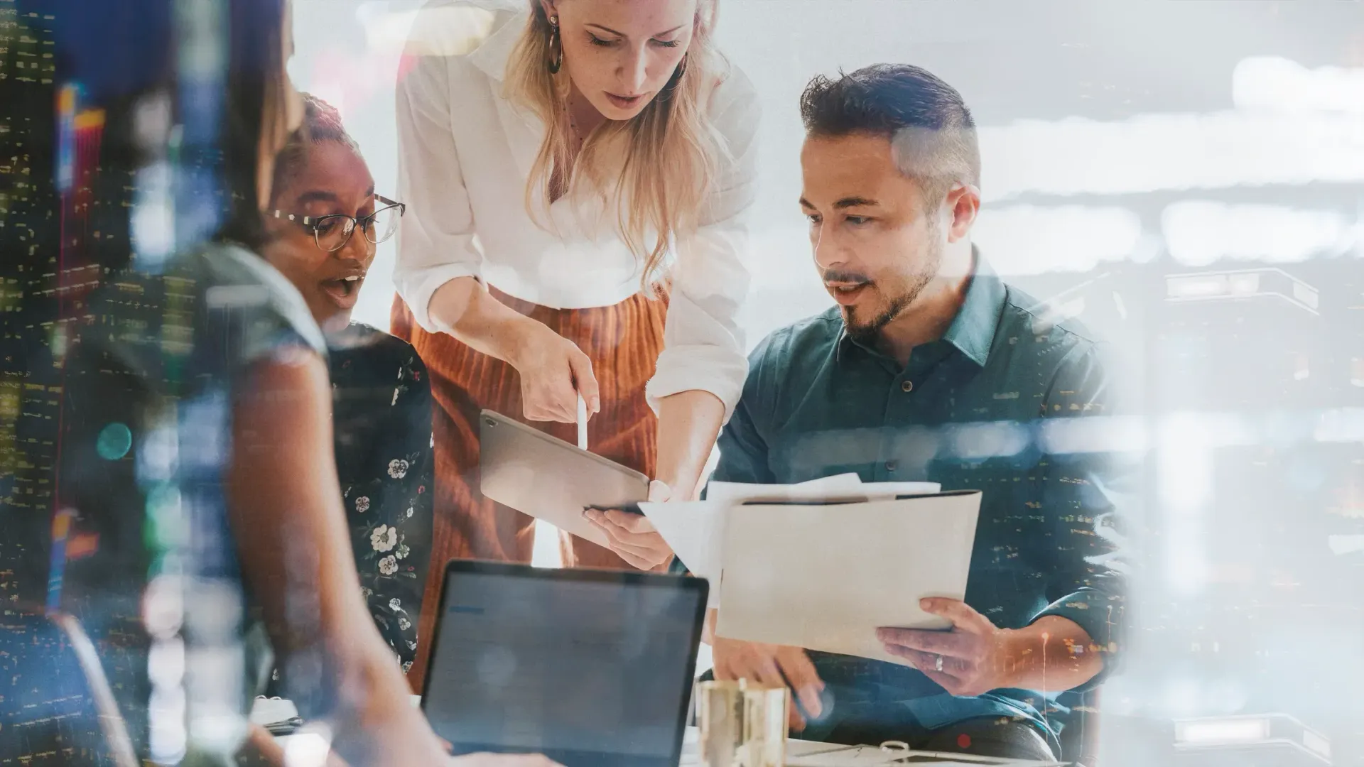 A woman in an apron and yellow gloves is holding a plate and a sponge.